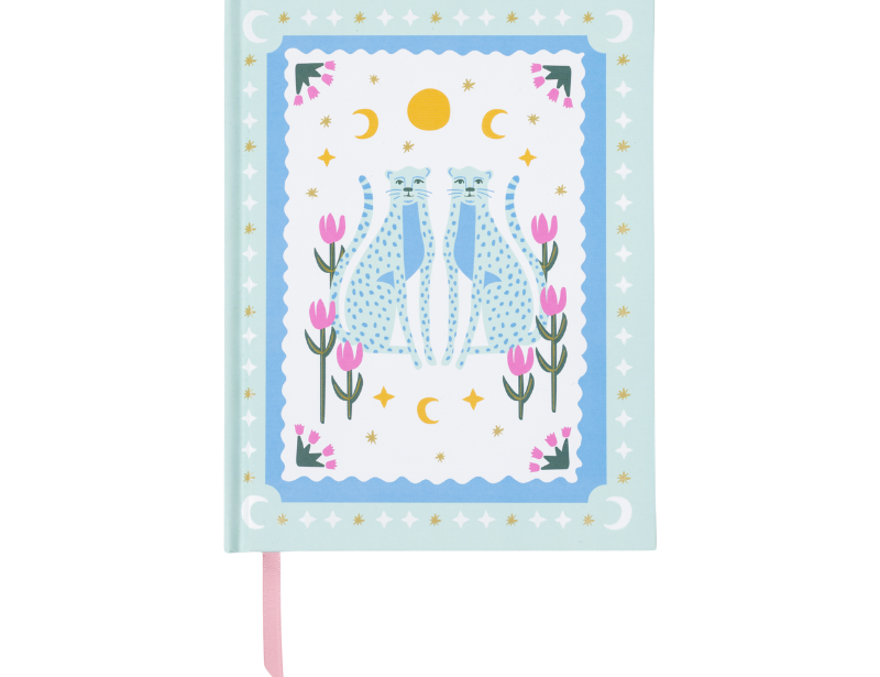 A Dopo Blue Cheetah Journal, a pale blue hardcover journal with two facing cheetahs inside a decorative border, tulips, a sun and moons, and a pink ribbon marker