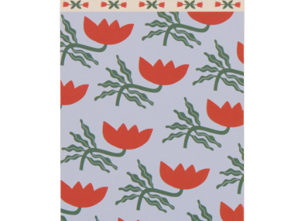 A Dopo Flower Twin Wire Notepad, a cream notepad printed with pink lotus flowers and a gold twin wire spiral across the top