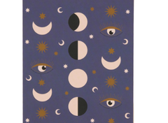 A Dopo Moon Phases Twin Wire Notepad, a deep purple notepad with moon phases, eyes and stars in cream and gold under a striped header band