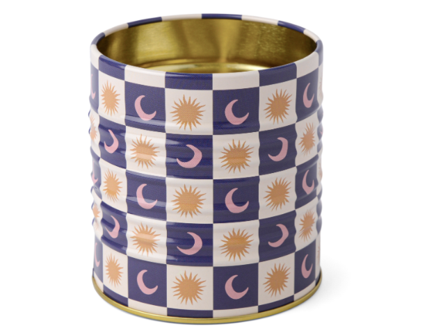 A Dopo Tin Celestial, a tin pencil cup in a navy and cream checkerboard with gold suns and moons and a gold interior