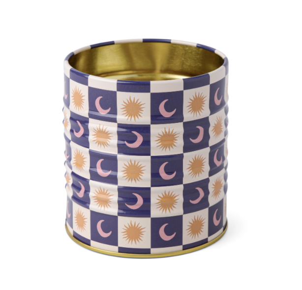A Dopo Tin Celestial, a tin pencil cup in a navy and cream checkerboard with gold suns and moons and a gold interior