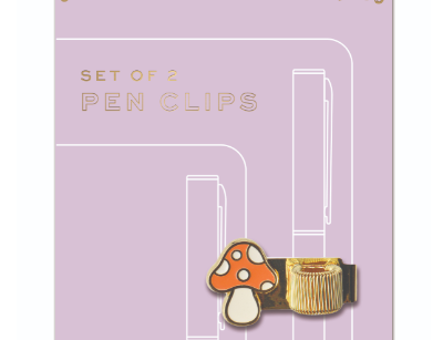 Butterfly and Mushroom Pen Clips, a lilac backer card holding two pen clips, a blue butterfly and a mushroom, each on a gold band