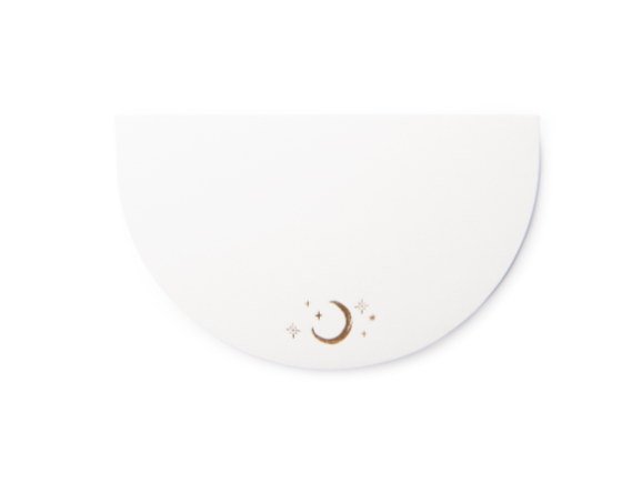 Half Moon Notepad Celestial, a half moon shaped notepad printed with a celestial design