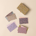 Designworks Notecards Set of 16, mustard floral box with scalloped floral cards in navy, purple and pink with envelopes