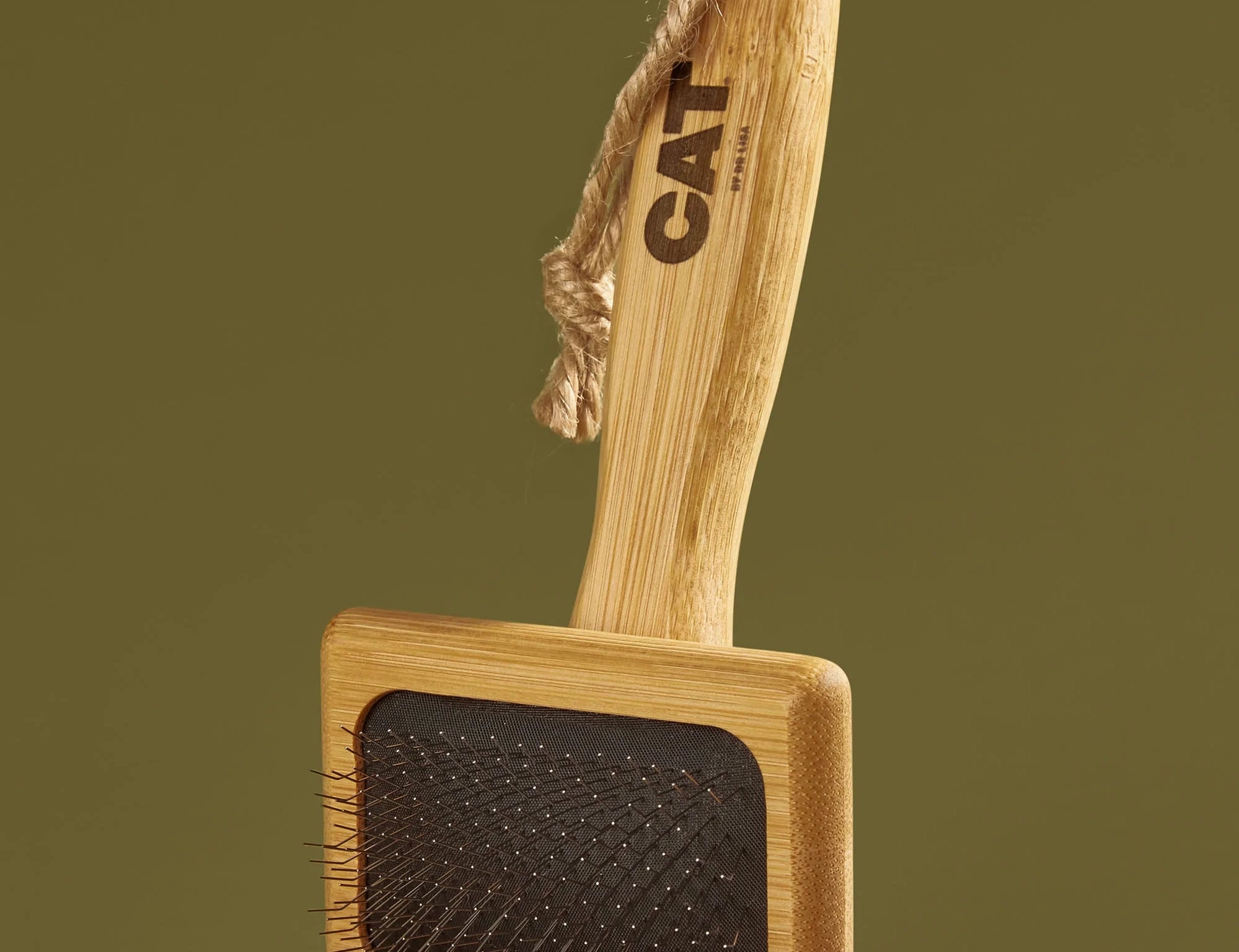 DOG by Dr Lisa Cat Slicker Brush with a bamboo handle and rope loop, standing upright