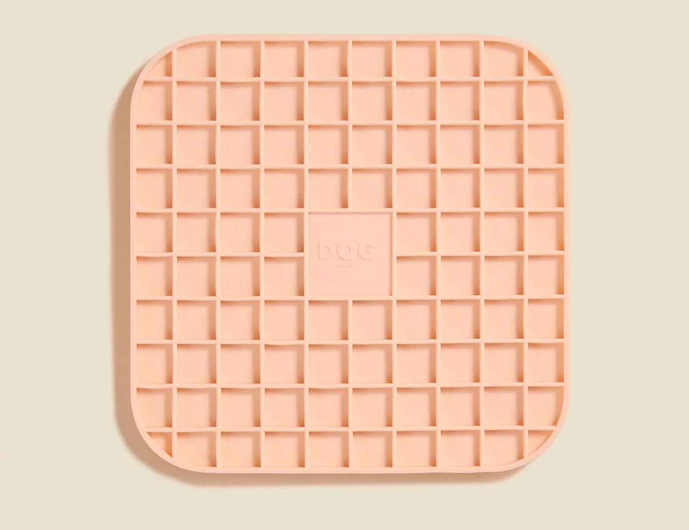 DOG by Dr Lisa DOG Lick Mat in Blush, a peach silicone mat with a waffle grid texture