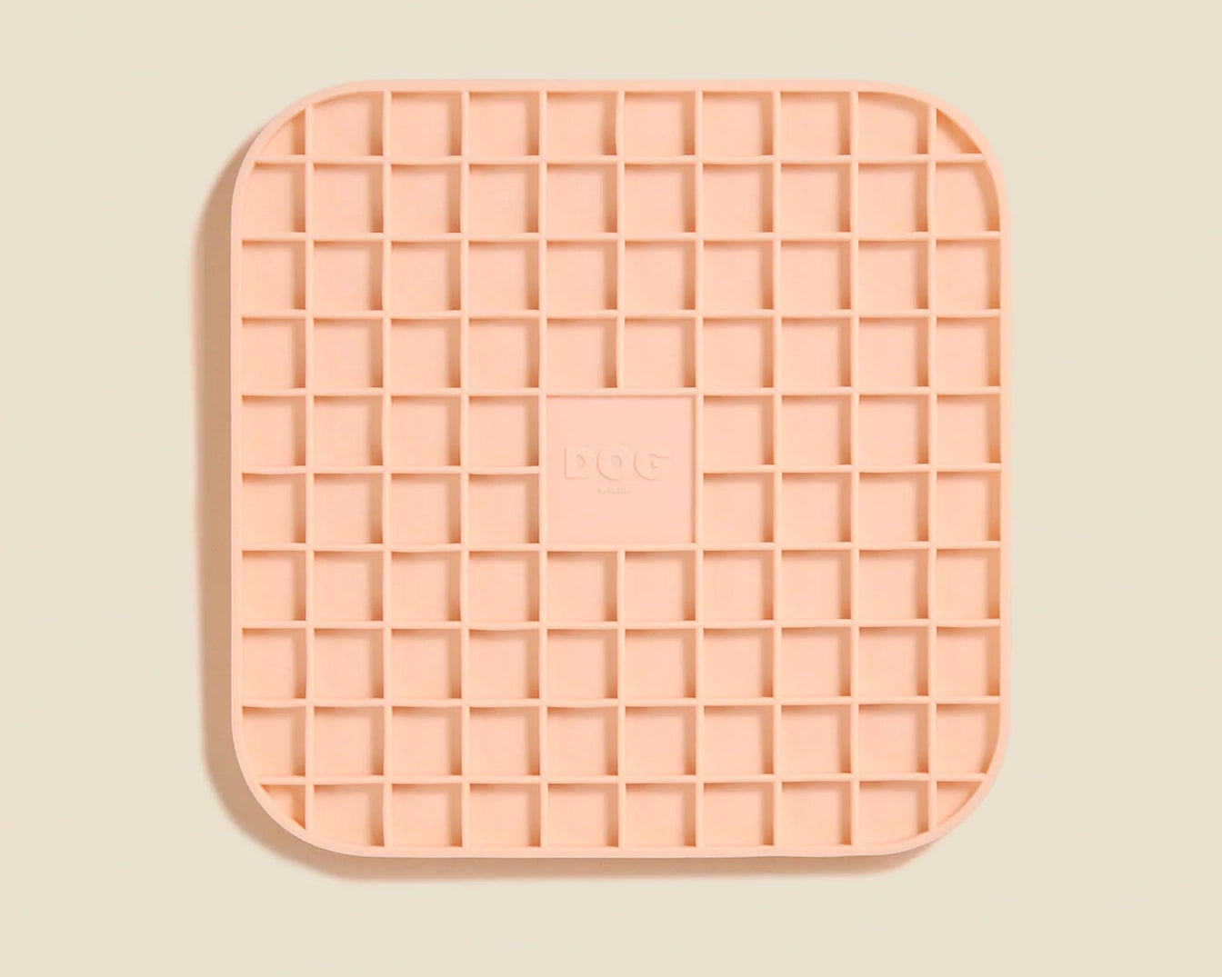 DOG by Dr Lisa DOG Lick Mat in Blush, a peach silicone mat with a waffle grid texture