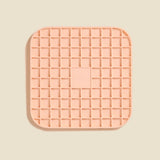 DOG by Dr Lisa DOG Lick Mat in Blush, a peach silicone mat with a waffle grid texture