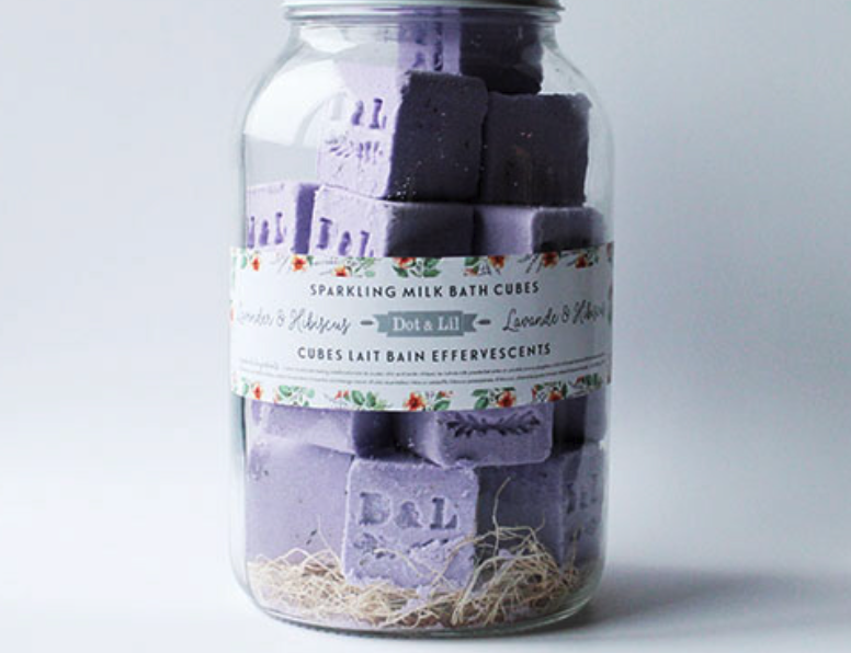 Dot & Lil Lavender & Hibiscus Sparkling Milk Bath Cubes, purple cubes stamped D&L in a glass jar