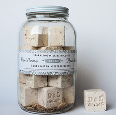 Dot & Lil Rice Flower Sparkling Milk Bath Cubes, cream cubes stamped D&L in a large glass jar