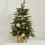 E + E Ornaments, second view, a small Christmas tree in a gold pot decorated with gold ornaments