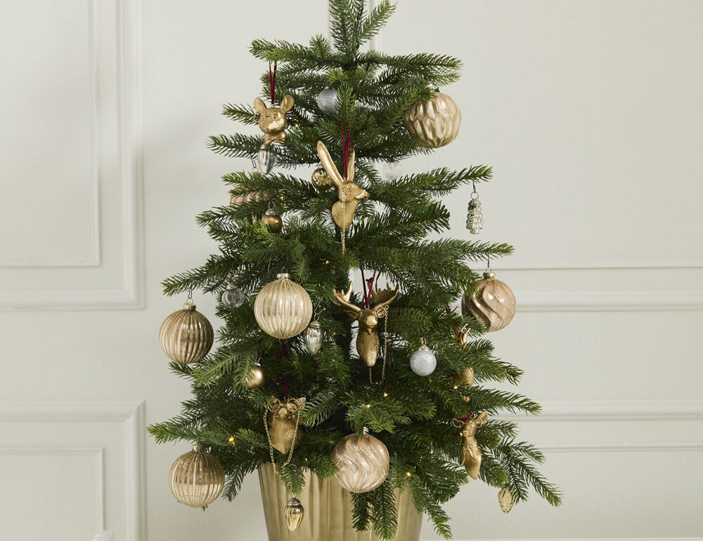 E + E Ornaments, second view, a small Christmas tree in a gold pot decorated with gold ornaments