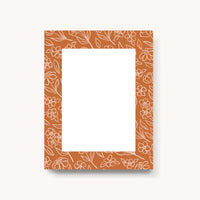 Elyse Breanne Terracotta Floral Notepad, a small white pad with a terracotta floral border on cream