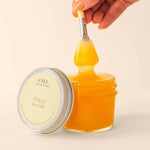 Farmhouse Fresh Honey Heel Glaze, a jar of golden honey glaze dripping from a brush
