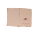 The inside cover of the Mulberry Floral notebook, showing the printed quote and a small pink flower illustration.