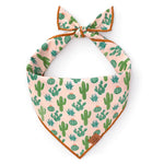 Foggy Dog Dog Bandana in Desert Cactus, a blush pink tie-on bandana with a green cactus print