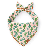 Foggy Dog Dog Bandana in Desert Cactus, a blush pink tie-on bandana with a green cactus print