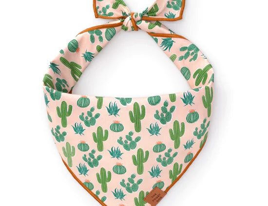 Foggy Dog Dog Bandana in Desert Cactus, a blush pink tie-on bandana with a green cactus print
