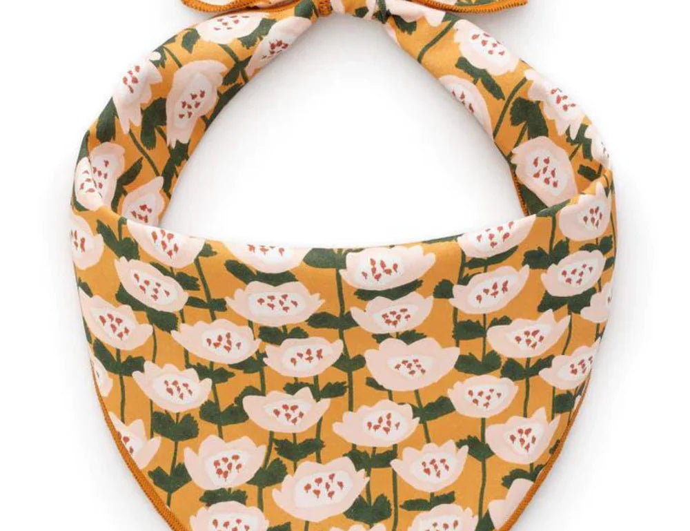 Foggy Dog Dog Bandana in Golden Flowers, a mustard yellow tie-on bandana with white floral print