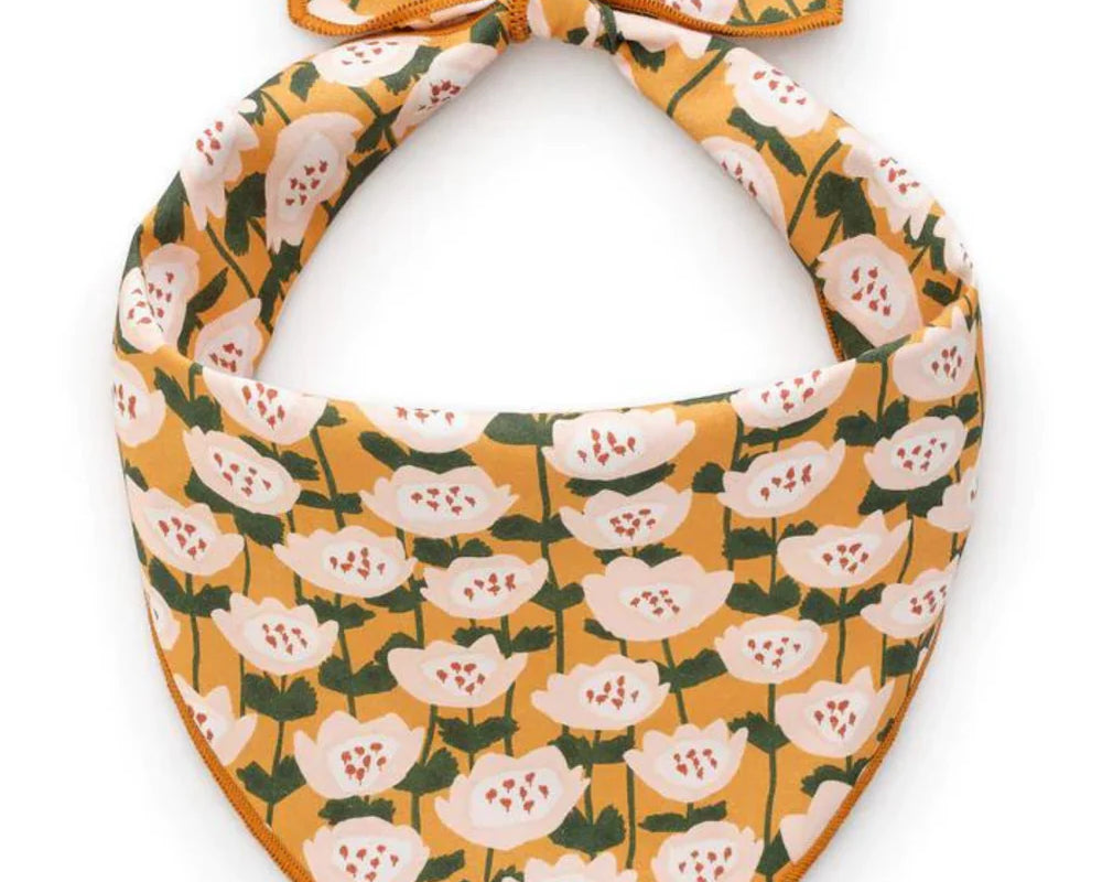 Foggy Dog Dog Bandana in Golden Flowers, a mustard yellow tie-on bandana with white floral print
