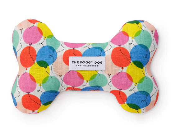 Foggy Dog Dog Squeaky Toy in Balloons, a plush bone with a colorful balloon print