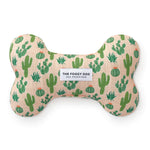 Foggy Dog Dog Squeaky Toy in Desert Cactus, a blush plush bone with a green cactus print