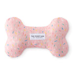 Foggy Dog Dog Squeaky Toy in Sprinkles, a pink plush bone with a colorful sprinkle print