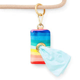 Foggy Dog Poop Bag Holder in Over the Rainbow clipped to a leash with a bag pulled through