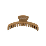 Frenchie claw clip in Caramel, mini size, a matte tan hair claw clip with desert sol script on the top tab, on a white background.