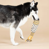 Husky carrying the Fringe Studio High There giraffe canvas dog toy