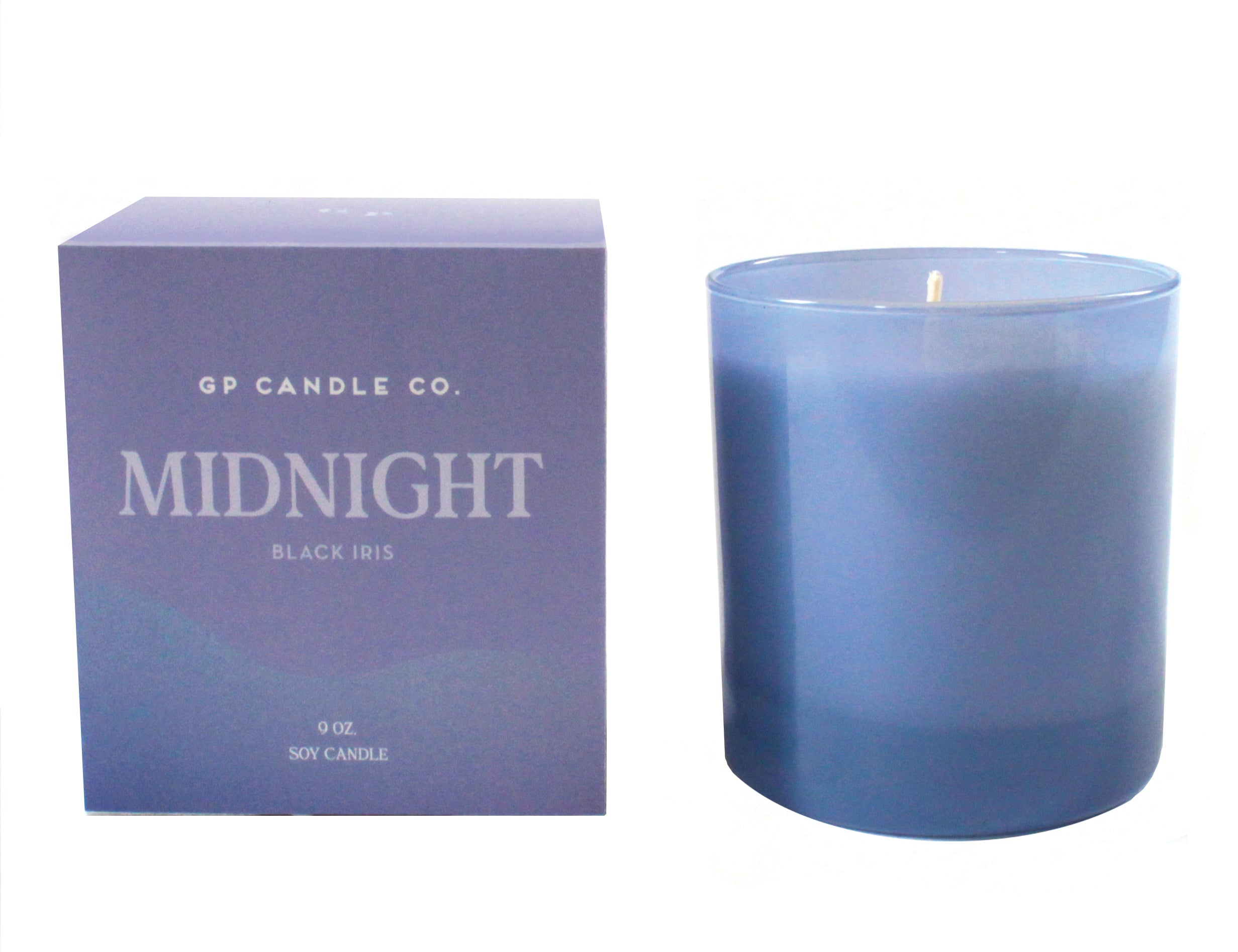 GP Candle Co Midnight 9oz Candle, a periwinkle blue glass candle beside its purple box