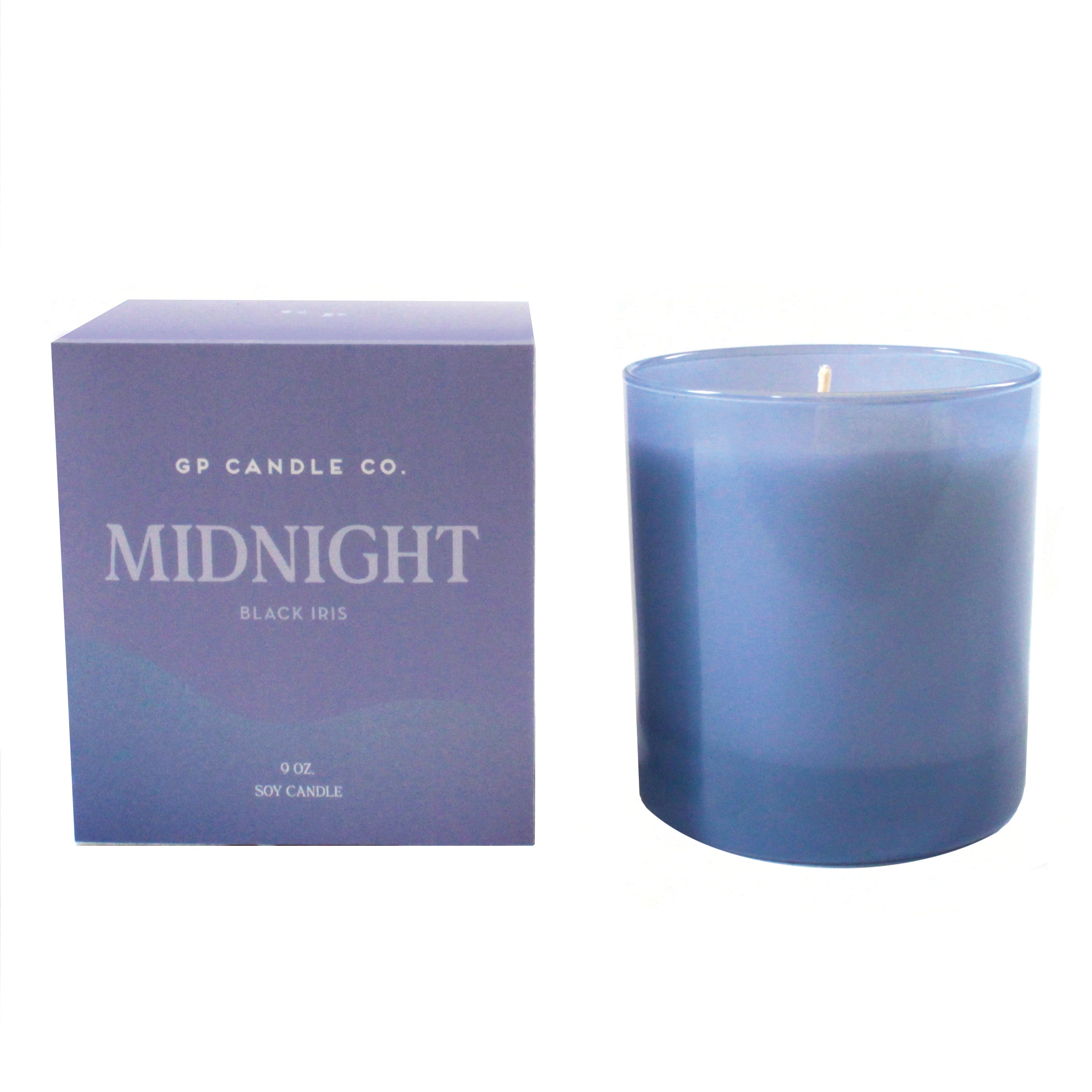 GP Candle Co Midnight 9oz Candle, a periwinkle blue glass candle beside its purple box