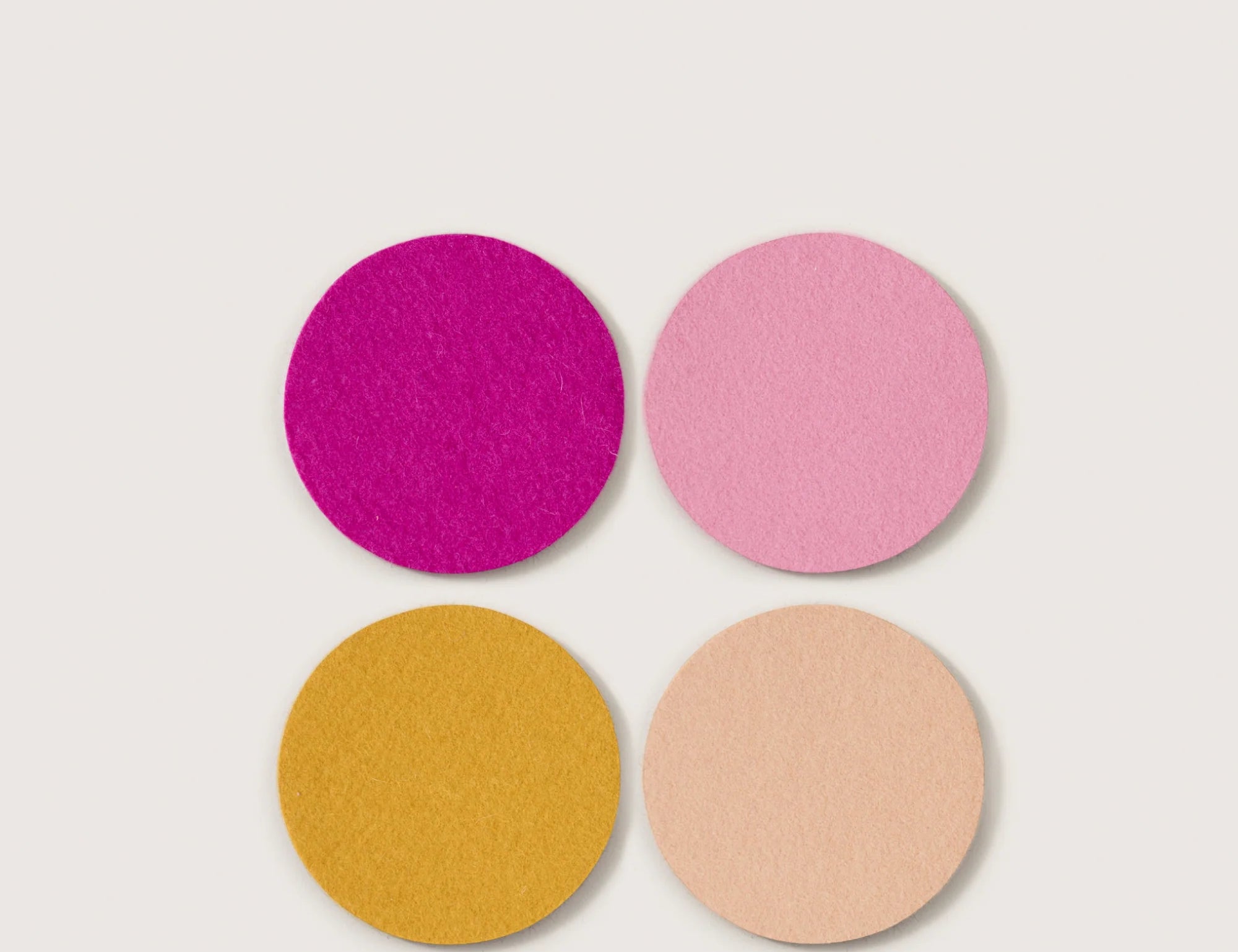 Graf Lantz Bierfilzl Merino Wool Round Coasters in Superbloom, four felt coasters in magenta, pink, mustard and peach