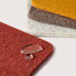 Close-up of water droplets beading on the Graf Lantz Bierfilzl Square Coasters in Desert Sun