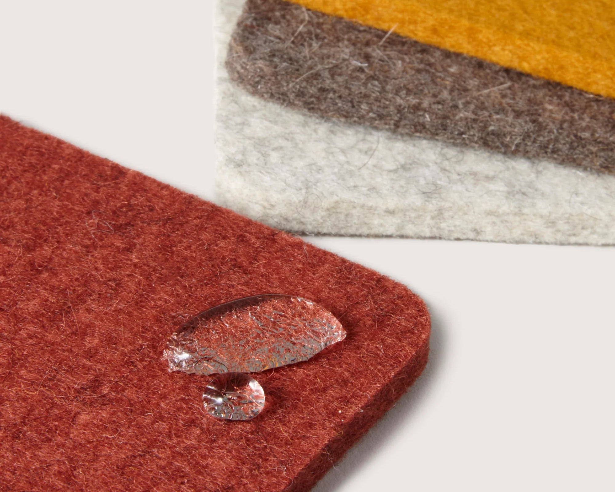 Close-up of water droplets beading on the Graf Lantz Bierfilzl Square Coasters in Desert Sun