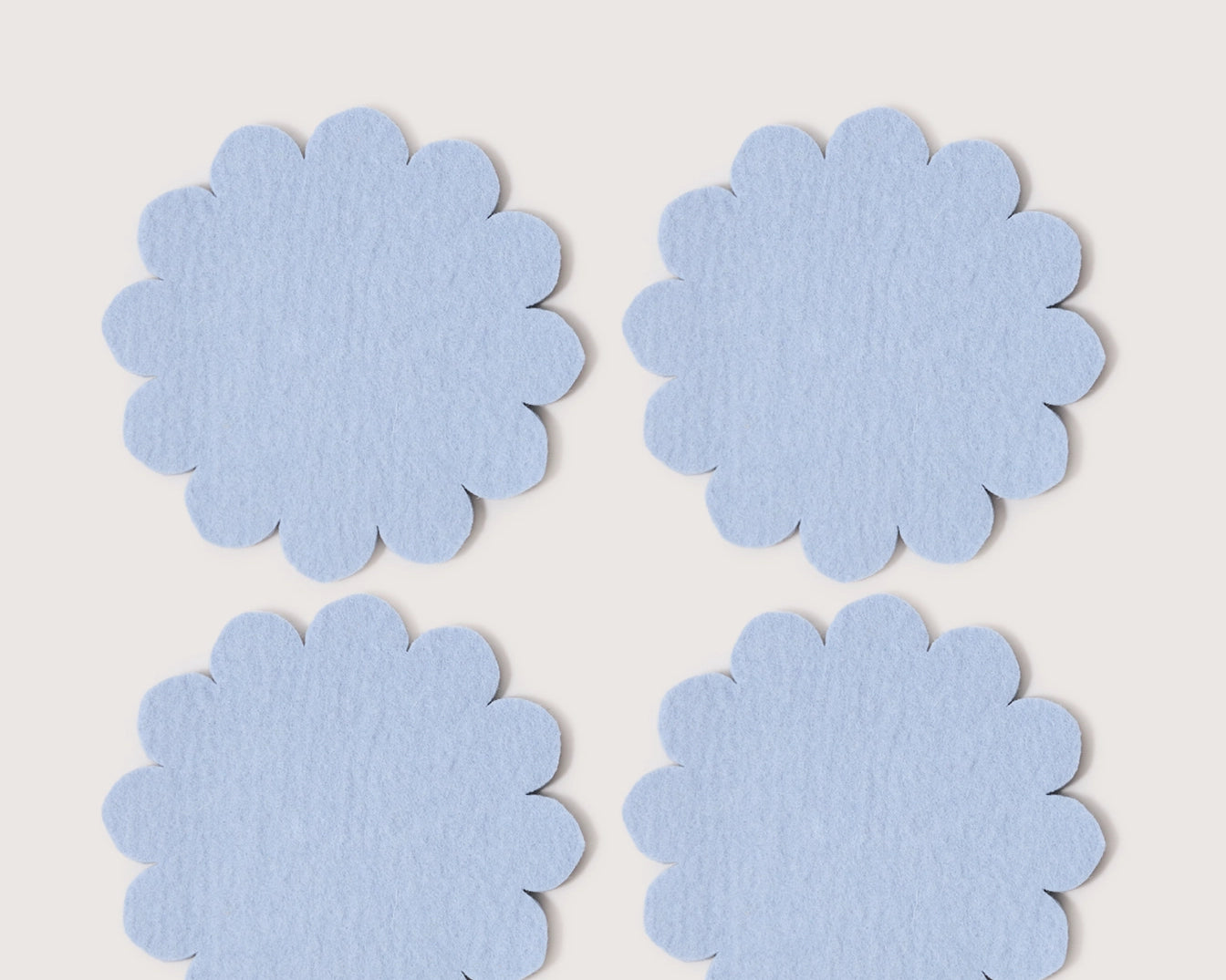 Graf Lantz Coaster Crest 4 Pack in Sky, four scalloped light blue merino felt coasters