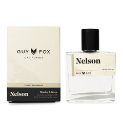 Guy Fox Nelson Men's Cologne, a clear glass bottle with a black cap beside its cream and black box