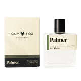 Guy Fox Palmer Men's Cologne, a clear glass bottle with a black cap beside its cream and black box
