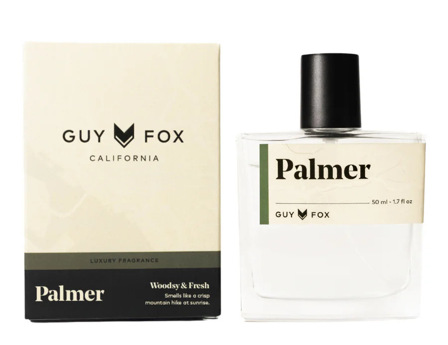 Guy Fox Palmer Men's Cologne, a clear glass bottle with a black cap beside its cream and black box