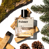 Guy Fox Palmer Men's Cologne bottle with cedar wood blocks, pine sprigs and pinecones