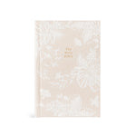 Hosanna Revival NLT Compact Bible in the Casablanca theme, a cream cover with a tonal white floral print