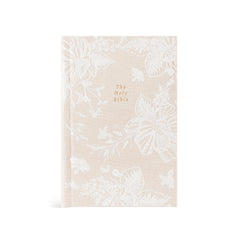 Hosanna Revival NLT Compact Bible in the Casablanca theme, a cream cover with a tonal white floral print