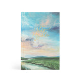 Hosanna Revival NLT Compact Bible in the Prairie theme, a painted sky and green field cover
