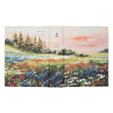 Hosanna Revival NLT Notetaking Bible Coram theme full cover spread with the wildflower meadow painting