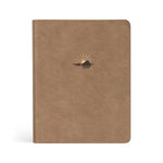 Hosanna Revival NLT Notetaking Bible in the Galilee theme, a tan faux leather cover with a gold sunrise emblem