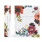 Hosanna Revival NLT Notetaking Bible Madrid theme shown with its floral spine