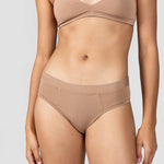 Close-up front view of the Huha Mineral Cheeky underwear and bralette in Tan
