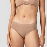 Close-up front view of the Huha Mineral Cheeky underwear and bralette in Tan
