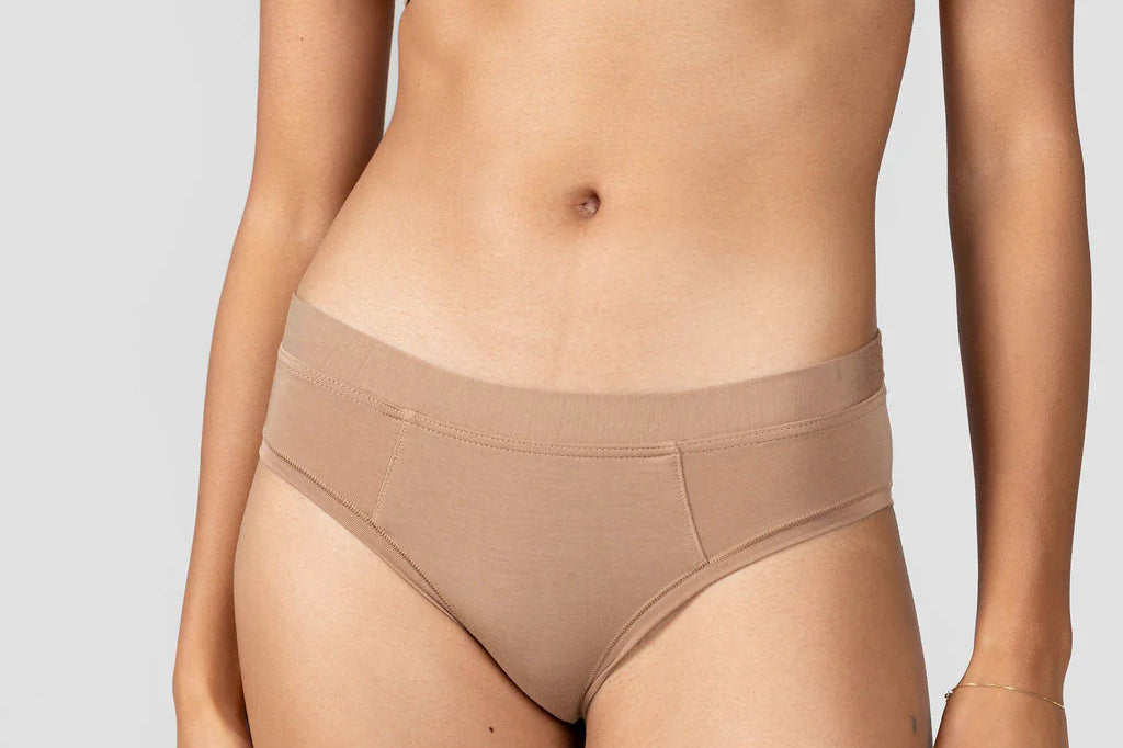Close-up front view of the Huha Mineral Cheeky underwear and bralette in Tan