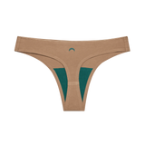 Huha Seamless Low Mid Thong in Tan, front view laid flat with the teal gusset and moon logo